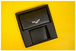  men's bi-fold wallet and a women's envelope-style clutch 