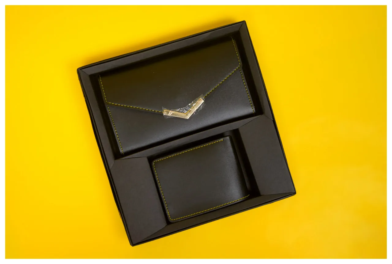  men's bi-fold wallet and a women's envelope-style clutch 